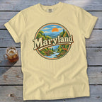Yellow t-shirt with circular Maryland landscape graphic featuring a river and deer.