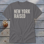 Grey t-shirt with "NEW YORK RAISED" printed in off-white.