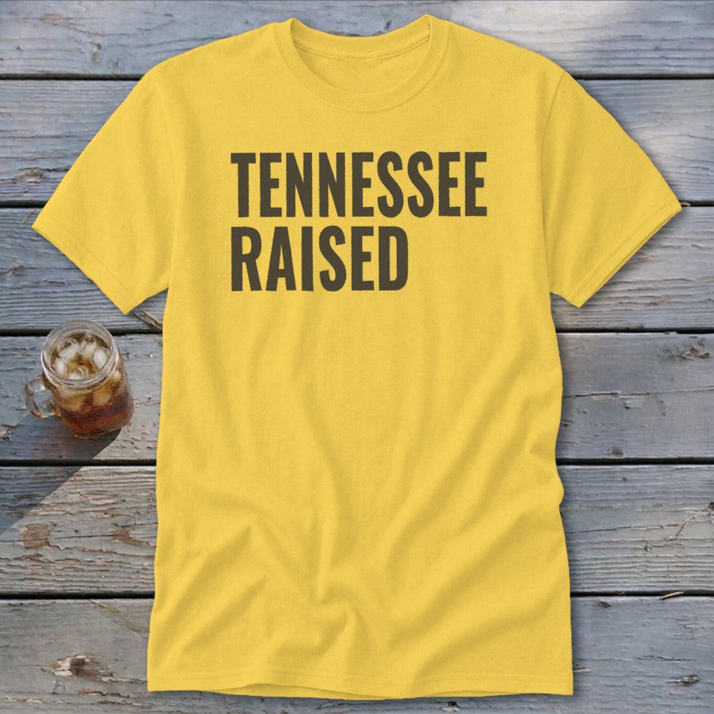 Yellow t-shirt with "TENNESSEE RAISED" in bold black letters.