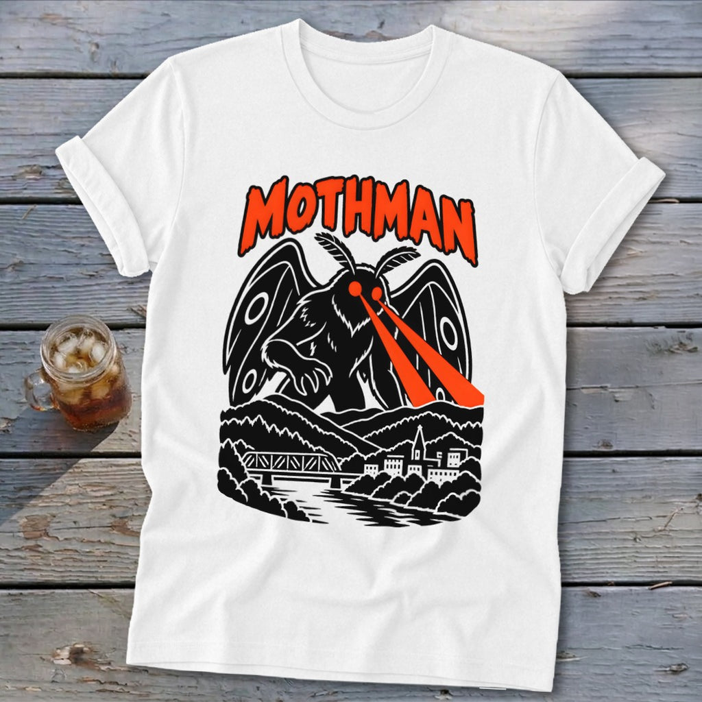 White t-shirt featuring a black Mothman design with orange eyes and text.