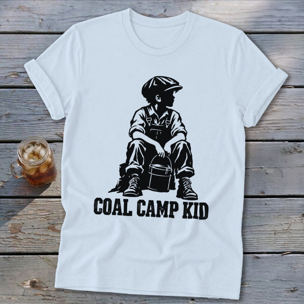 White t-shirt with graphic of a boy in overalls holding a bucket, text reads "COAL CAMP KID".