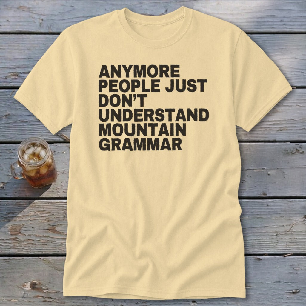 Light yellow t-shirt with black text: "ANYMORE PEOPLE JUST DON'T UNDERSTAND MOUNTAIN GRAMMAR".
