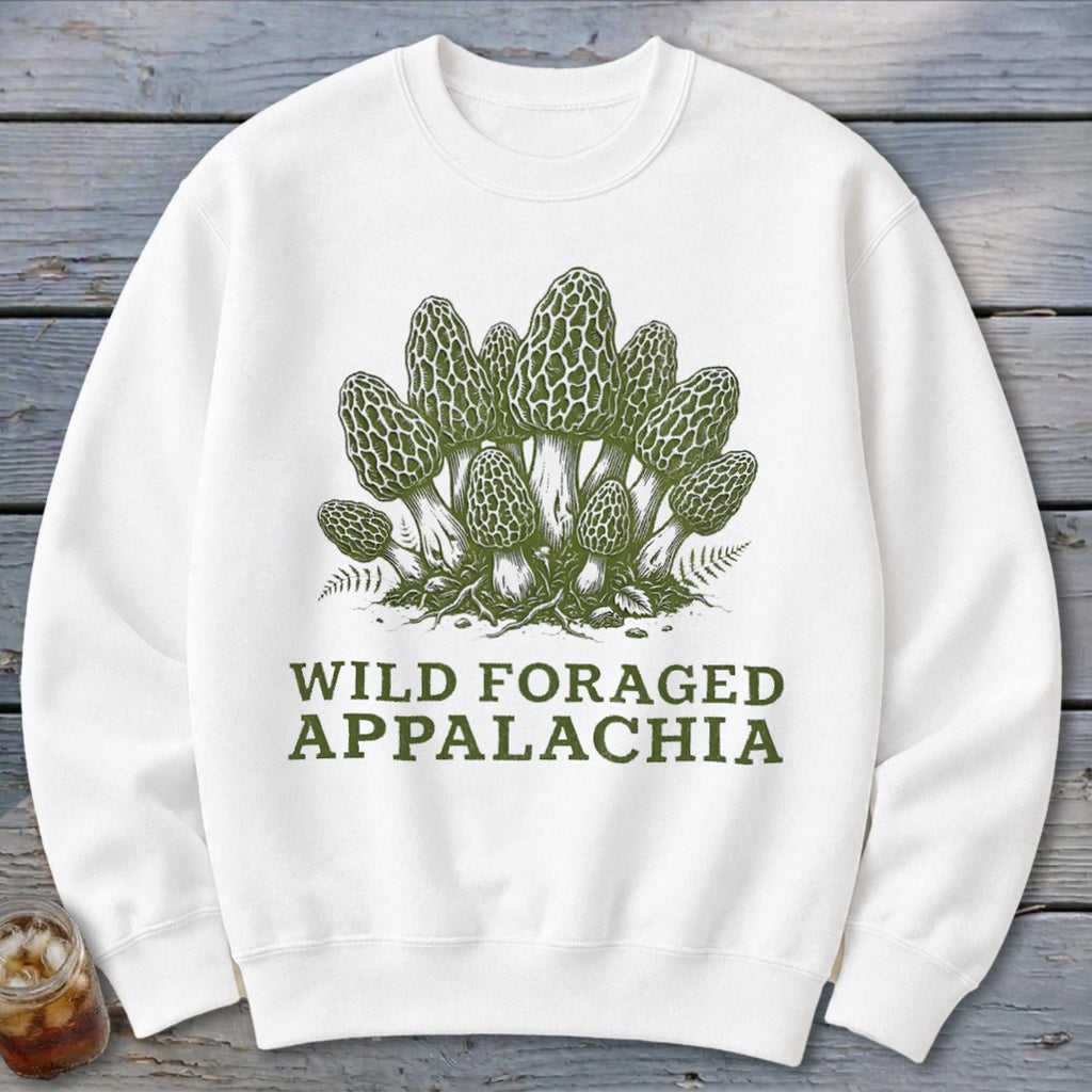White sweatshirt with green illustration of morel mushrooms and text "WILD FORAGED APPALACHIA".