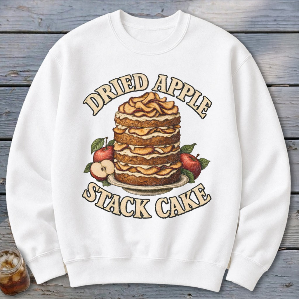 White sweatshirt with a "Dried Apple Stack Cake" graphic featuring a layered cake and apples.