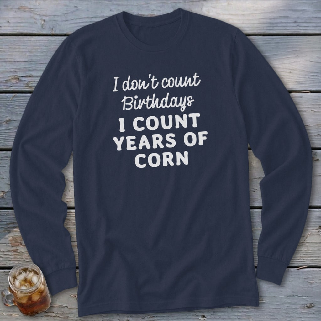Navy long-sleeve shirt with "I don't count birthdays I count years of corn" text.