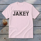 Pink t-shirt with "LOOKING A LITTLE JAKEY" text in black.