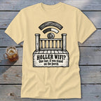 A cream-colored t-shirt with a black graphic of a porch and the text "HOLLER WIFI? One bar, if you stand on the porch".
