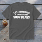 A dark gray t-shirt with white text that reads This Thanksgiving Is Sponsored By Soup Beans.