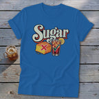 Royal blue t-shirt featuring a retro graphic of cornbread with a red X and iced tea with a green checkmark under the text Sugar.