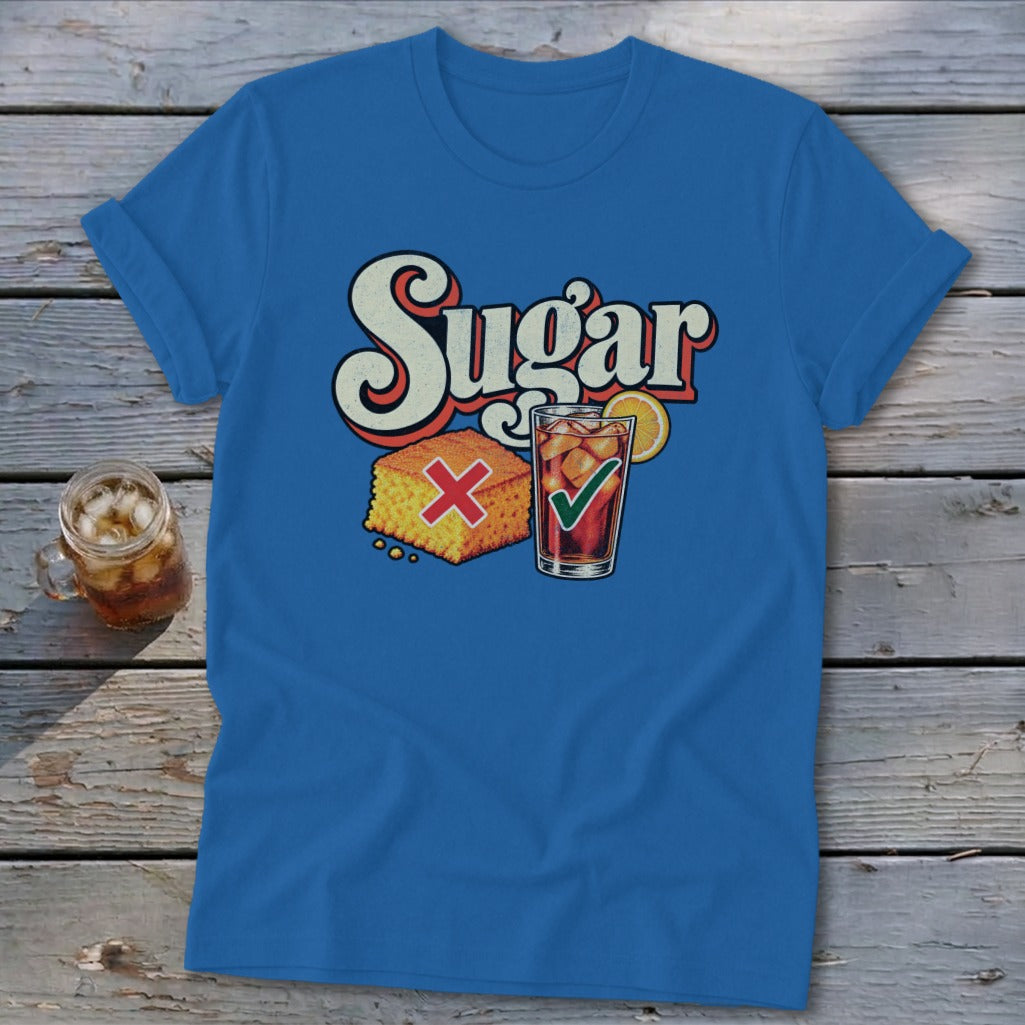 Royal blue t-shirt featuring a retro graphic of cornbread with a red X and iced tea with a green checkmark under the text Sugar.