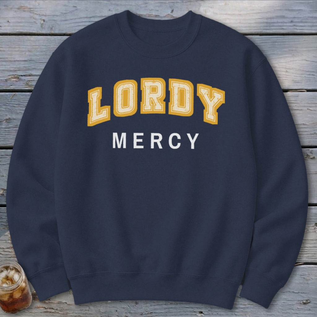 Navy sweatshirt with yellow text "LORDY" and white text "MERCY".