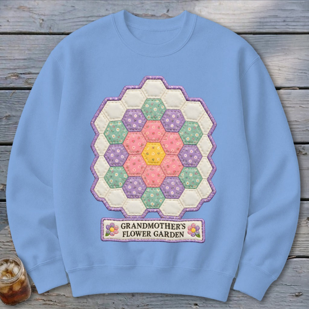 Light blue sweatshirt with hexagon patchwork design and "Grandmother's Flower Garden" text.