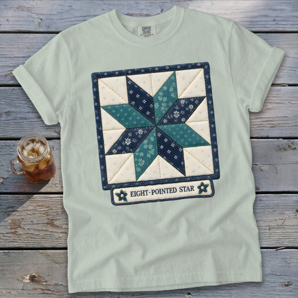 Light blue Comfort Colors t-shirt with an eight-pointed star quilt block design.
