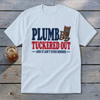 White t-shirt with "Plumb Tuckered Out" and rocking chair graphic.