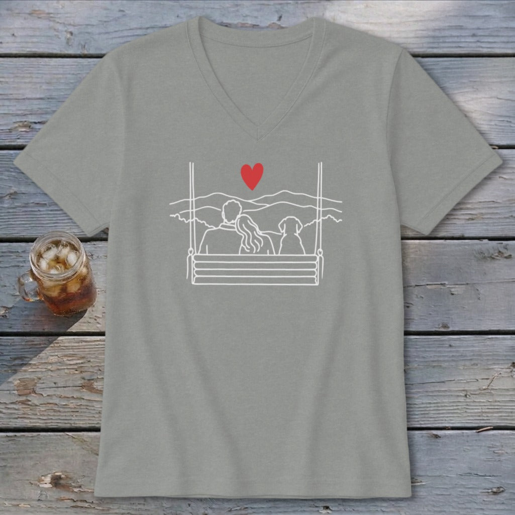 Grey v-neck t-shirt with a white line drawing of a couple and dog on a swing.