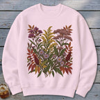 Pink crewneck sweatshirt with a detailed floral botanical illustration in muted autumn colors.