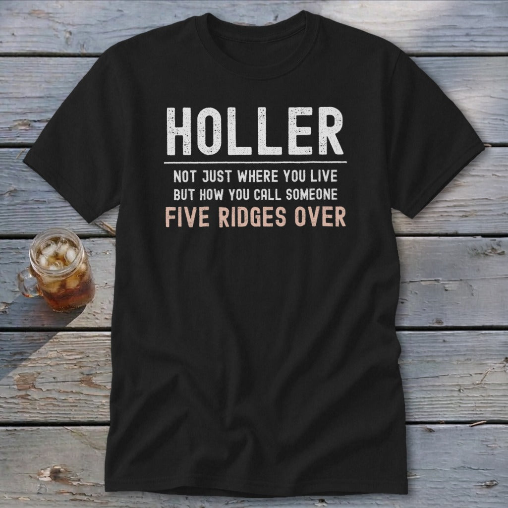 Black t-shirt with white text "HOLLER" and "NOT JUST WHERE YOU LIVE BUT HOW YOU CALL SOMEONE FIVE RIDGES OVER".