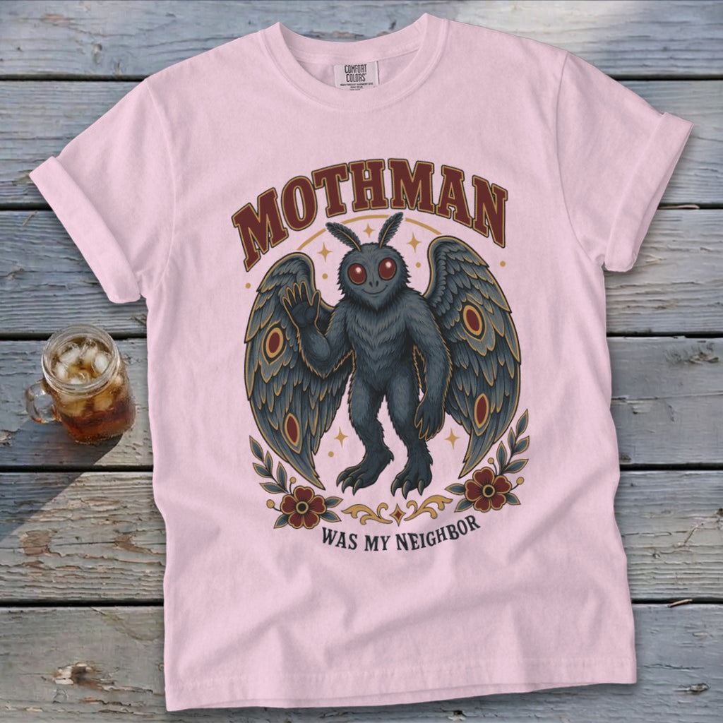 Light pink t-shirt with Mothman graphic and text "MOTHMAN WAS MY NEIGHBOR".