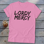 Pink t-shirt with black "LORDY MERCY" text and a glass of iced drink.