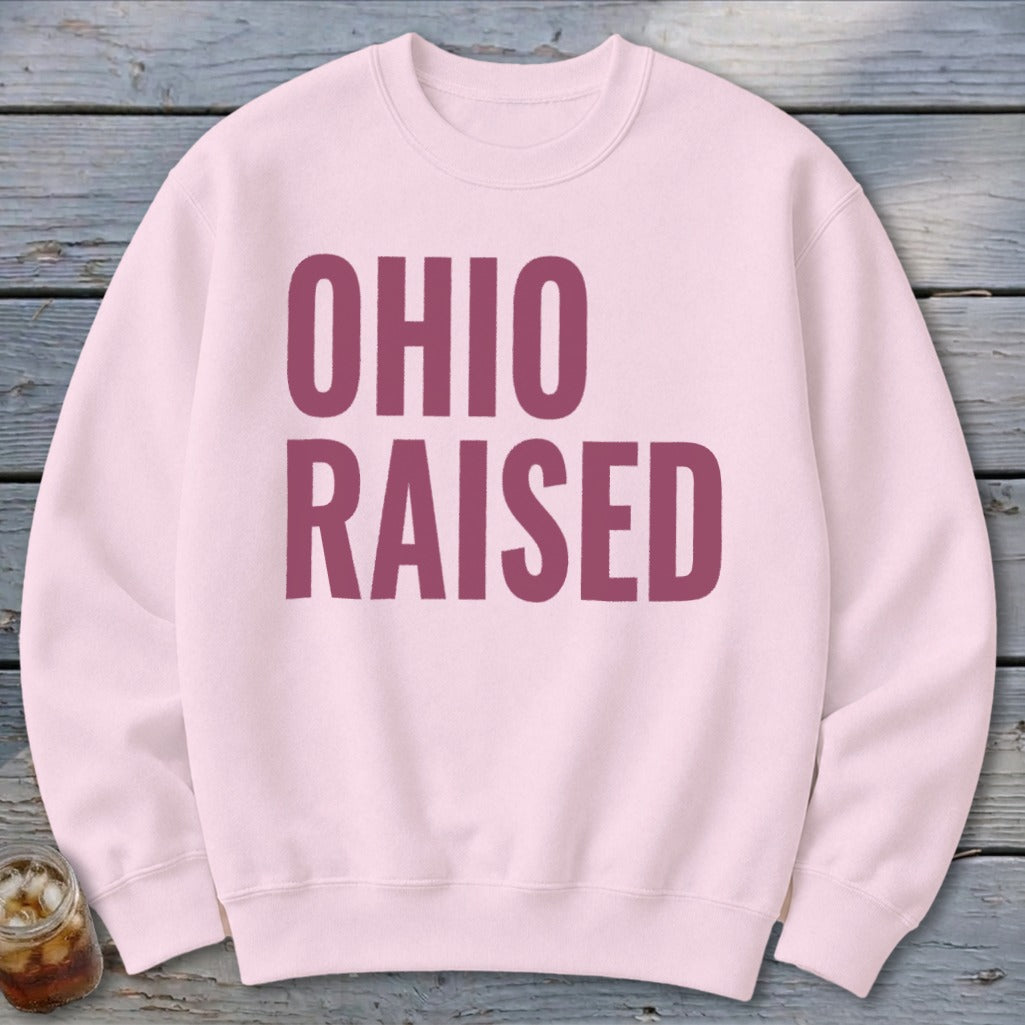 Pink crewneck sweatshirt with "OHIO RAISED" in maroon text.