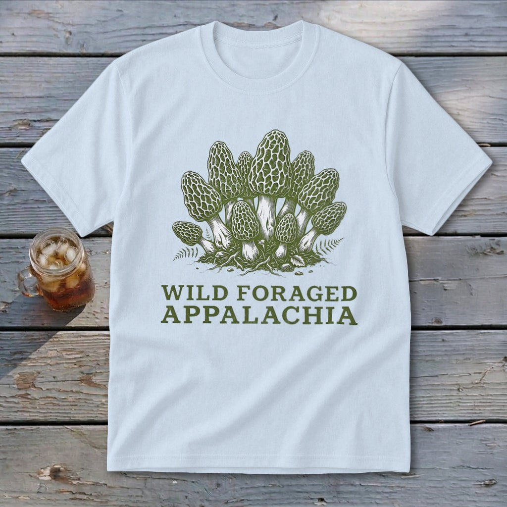 White t-shirt with a green graphic of morel mushrooms and text "WILD FORAGED APPALACHIA".