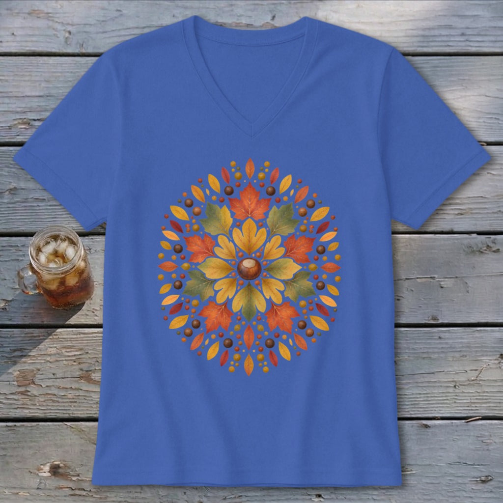 Blue v-neck t-shirt with an autumn leaf mandala design and a glass of iced tea.