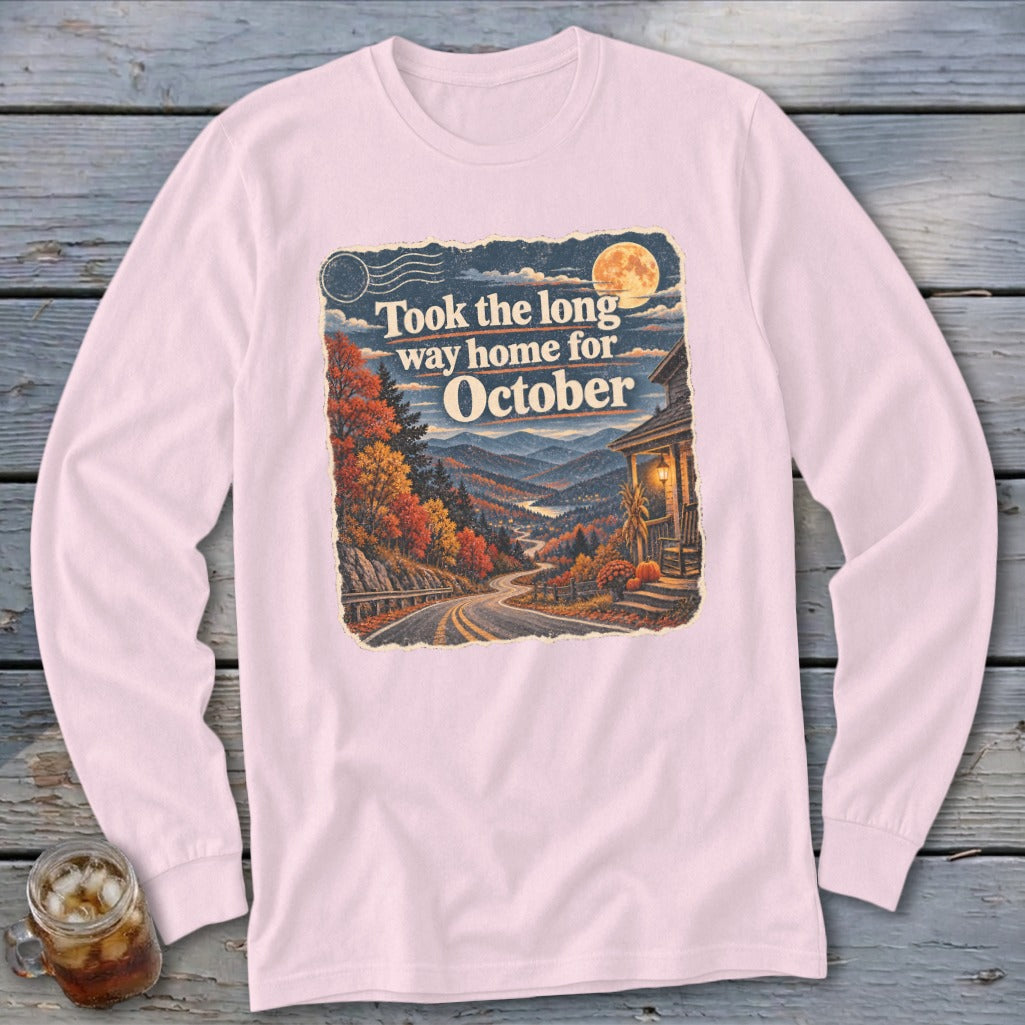 Long-sleeved shirt with vintage autumn mountain scene and text "Took the long way home for October."