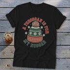 A black t-shirt with a graphic of a winter hat and the text A TOBOGGAN IS FOR MY NOGGAN.