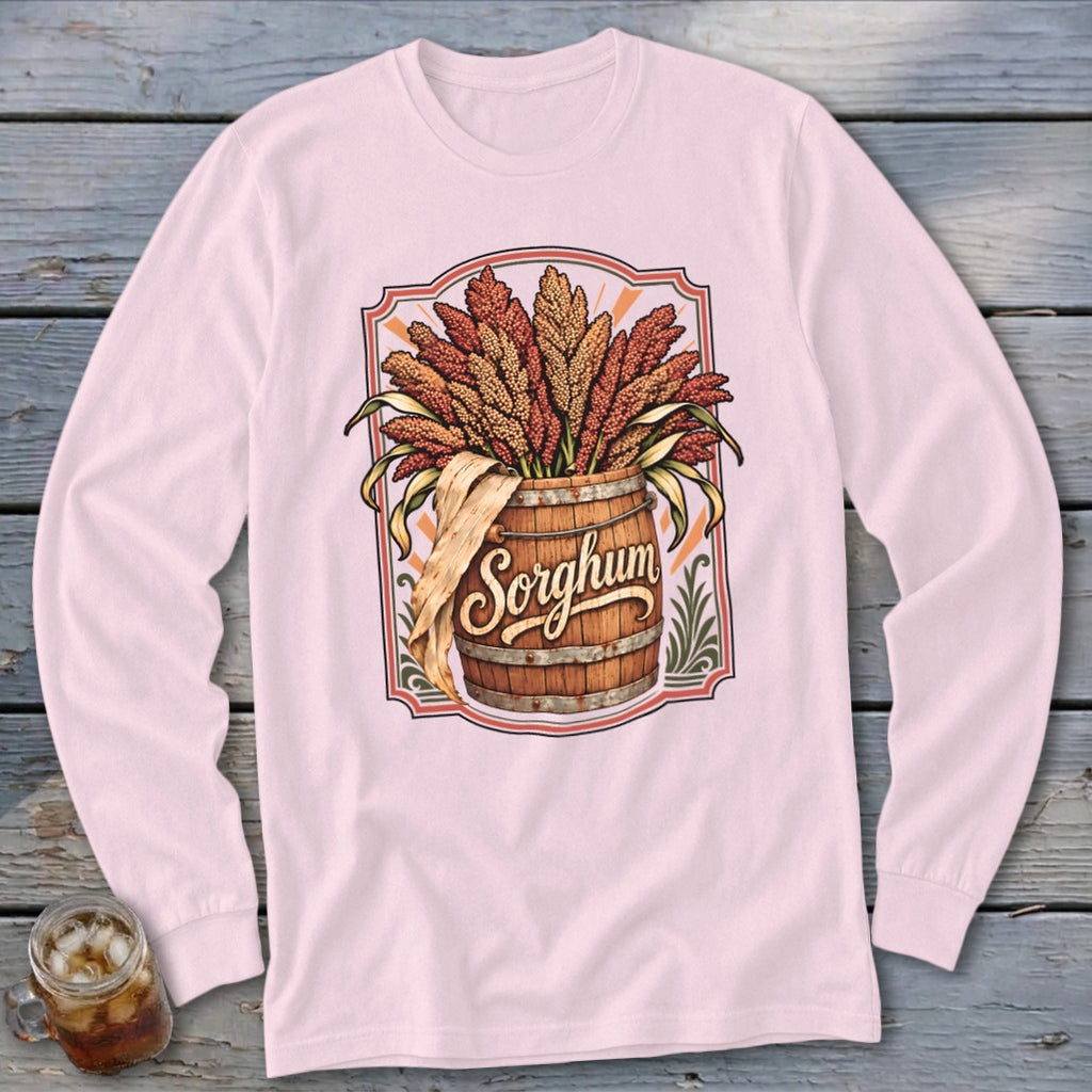 Pink long-sleeve shirt with a "Sorghum" graphic of stalks in a wooden barrel.