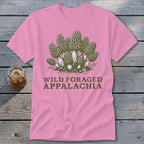 Pink t-shirt with a graphic of morel mushrooms and text that reads "Wild Foraged Appalachia".