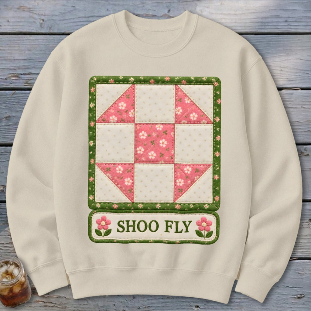 Cream sweatshirt with a quilt block design and the text "SHOO FLY".