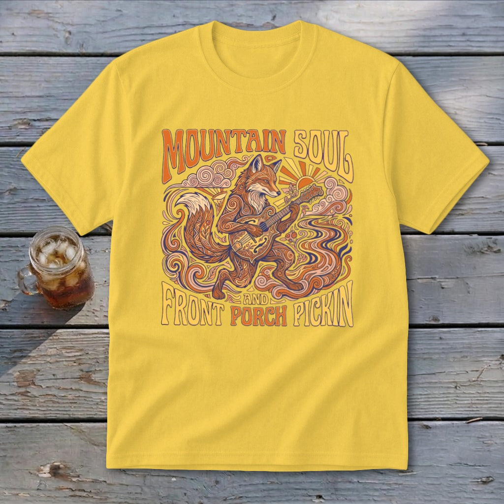 Yellow t-shirt with fox playing guitar and "Mountain Soul and Front Porch Pickin'" text.