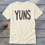 Cream t-shirt with "YUNS" in dark gray lettering and a glass of iced tea.