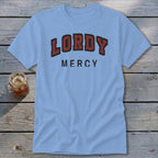 Light blue t-shirt with "LORDY MERCY" text in red and black arch font.