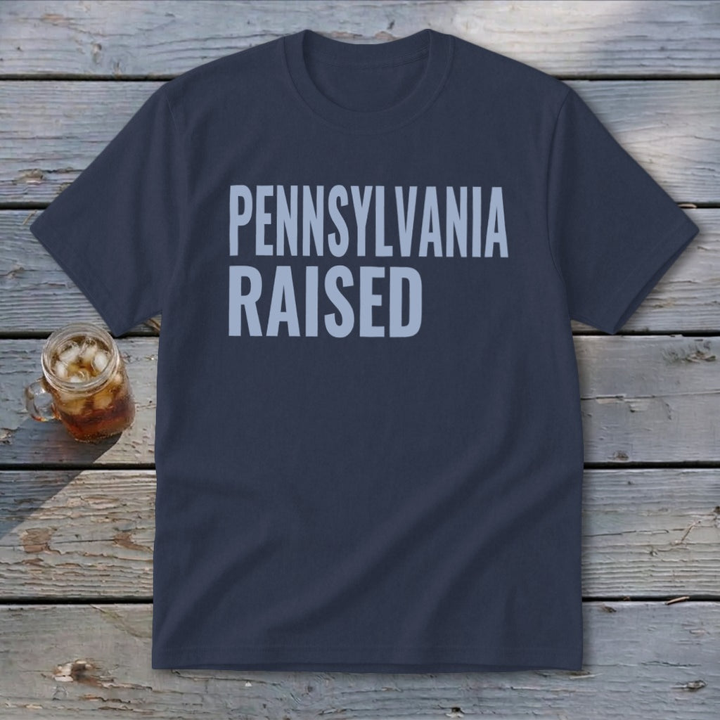 Navy t-shirt with "PENNSYLVANIA RAISED" printed in light blue letters.