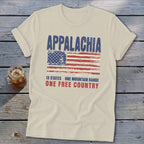 Cream-colored t-shirt featuring a distressed American flag graphic with the text Appalachia, 13 states, and one free country.