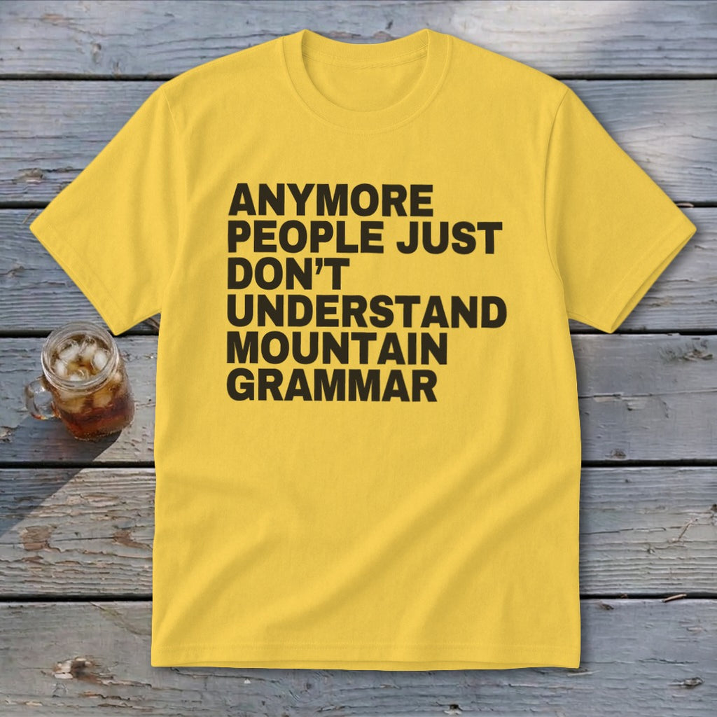 Yellow t-shirt with black text reading "Anymore people just don't understand mountain grammar."
