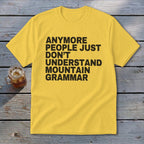 Yellow t-shirt with black text reading "Anymore people just don't understand mountain grammar."