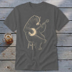 Dark gray t-shirt with a drawing of a bear sitting on a stool playing a banjo.
