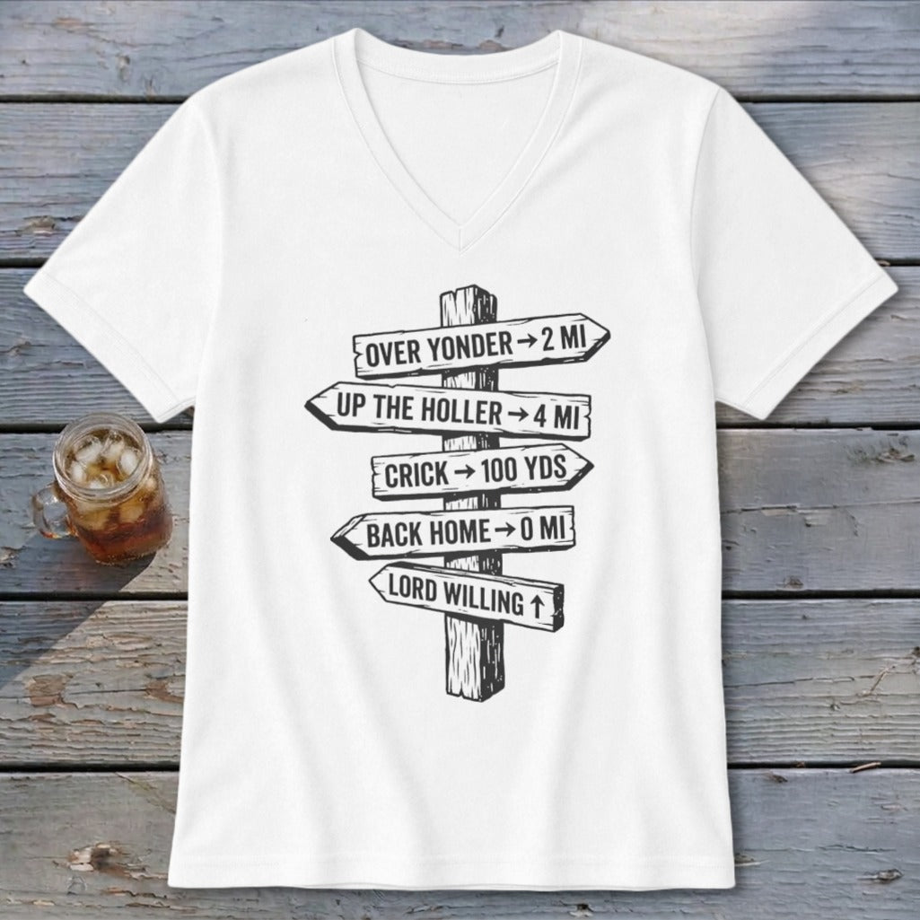 A white V-neck t-shirt featuring a rustic wooden directional sign graphic with humorous southern text.