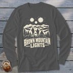 Dark gray long-sleeve t-shirt with a graphic of three figures looking at mountain lights.