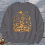 Grey sweatshirt with orange hiking graphic and text "If you hear whistlin', keep hiking."
