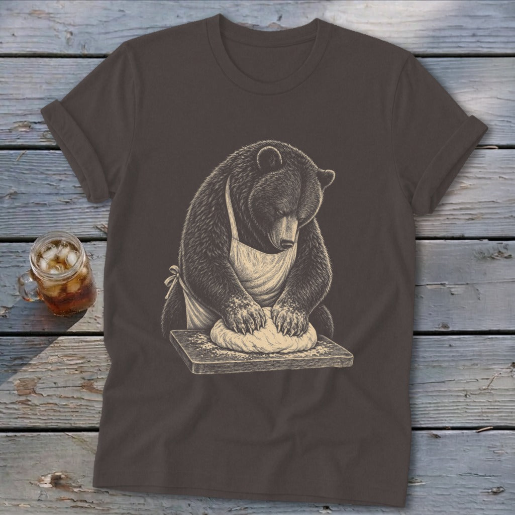 Bear wearing an apron kneading dough on a wooden board graphic on a t-shirt.