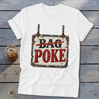 A white crewneck t-shirt featuring a graphic of a rustic wooden sign with the text BAG POKE.