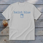 White t-shirt with "haint blue" text and paint can graphic.