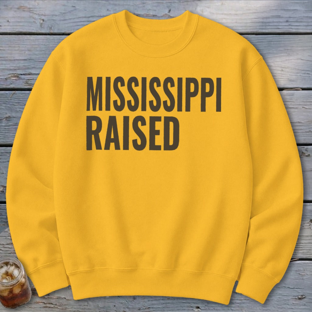 Yellow crewneck sweatshirt with "MISSISSIPPI RAISED" text in dark grey.