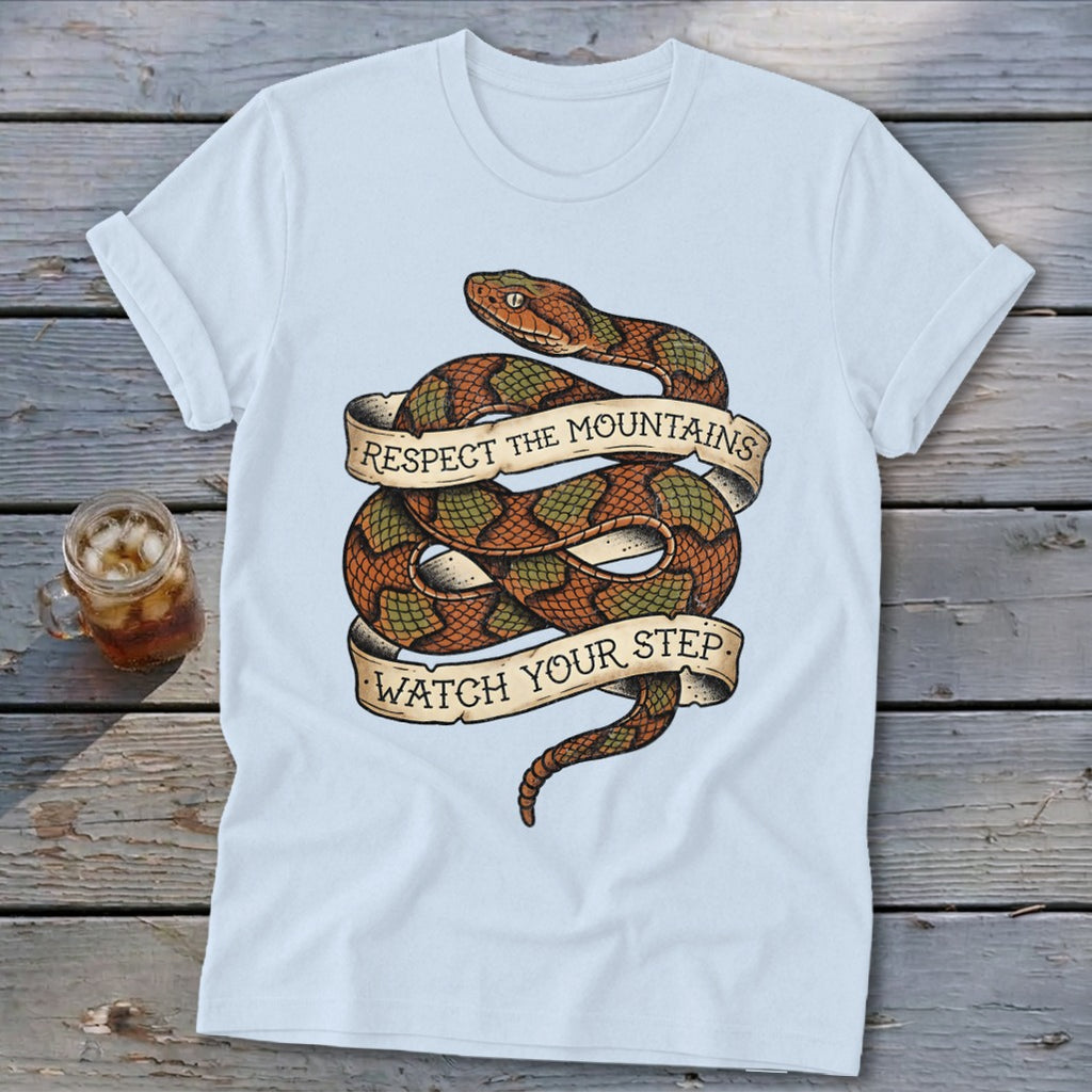 Light blue t-shirt with coiled snake graphic and banner text.