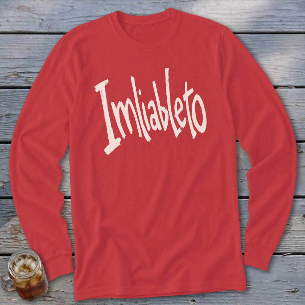 Red long-sleeve shirt with "Imliableto" in distressed white lettering.