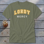 Olive green t-shirt with "LORDY MERCY" text in yellow and white.