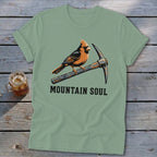 T-shirt with cardinal perched on a pickaxe, text reads "MOUNTAIN SOUL".